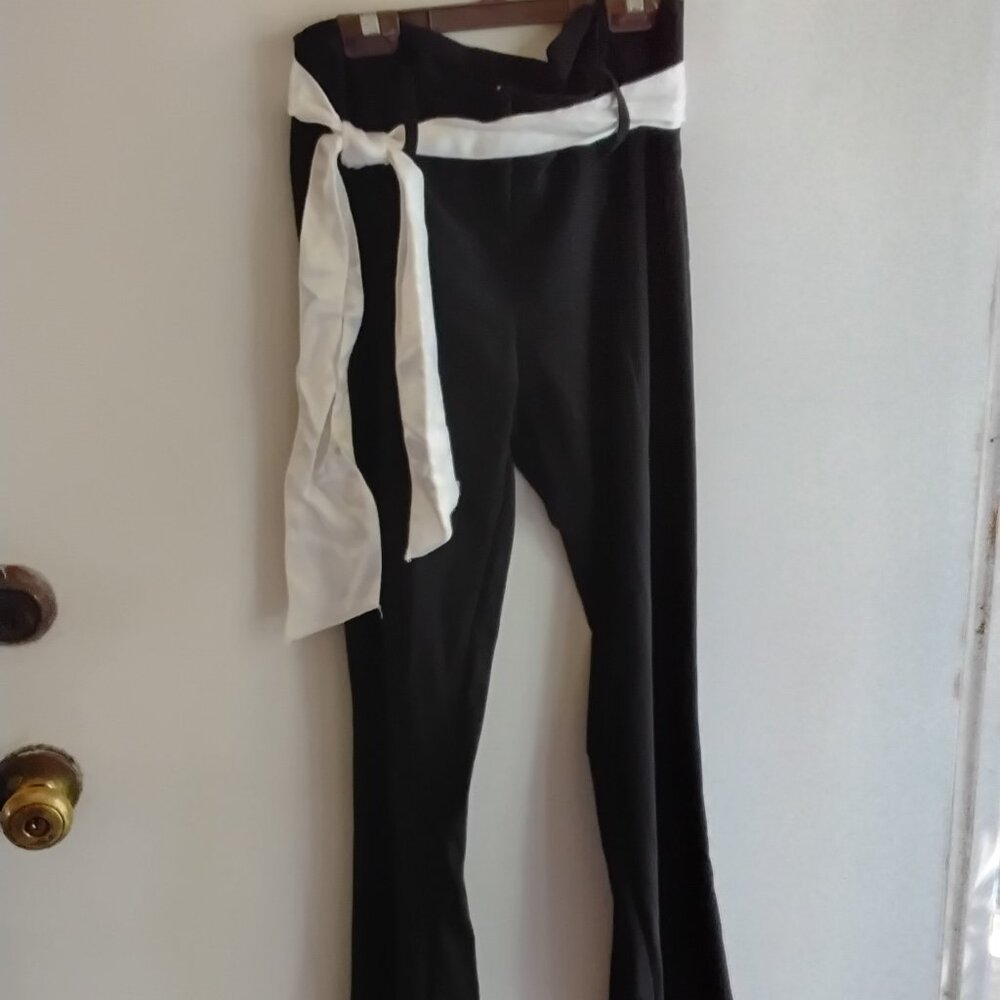 Two pairs of pants,  one black,  one white, same style,  size 7
